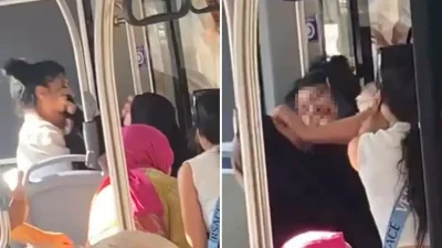 Denizli’de halk otobüsünde, 2 yaşındaki kızıyla yolculuk yapan çarşaflı kadın,