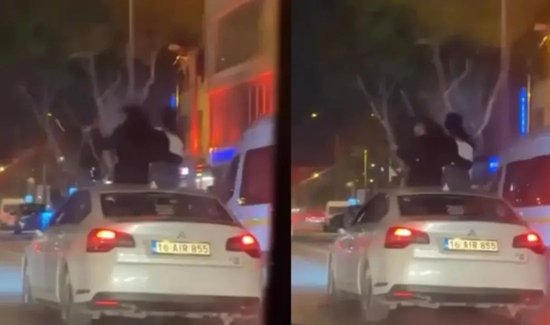 Bursa’da seyir halindeki bir otomobilin üzerine çıkarak yolculuk yapan şahıslar
